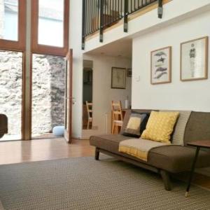 Central Mezzanine Apartment in Historic School