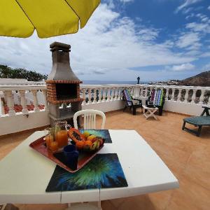 Rooftop sun lounge with ocean views