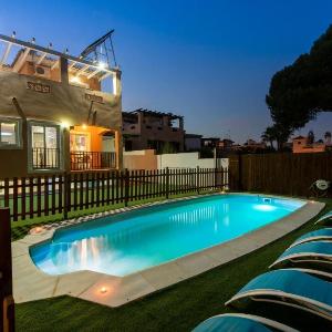 heated pool and an outdoor jacuzzi