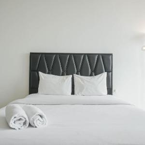 Minimalist Studio Room at Menteng Park By Travelio