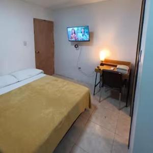 Confortable y Central Habitacion cerca a la Playa Spratt Bight y Malecon