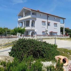 Apartments with parking space Lopar Rab - 21881
