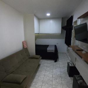 Sala living em prédio familiar na Avenida da praia