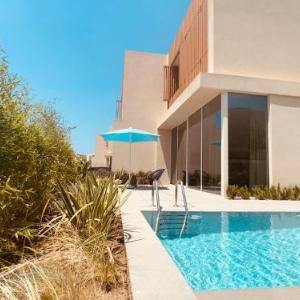 Green Coast beach villa with pool hot tub & sauna