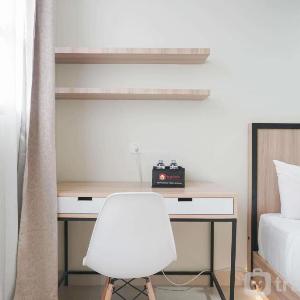 Nice and Cozy Studio at Evenciio Margonda Apartment By Travelio