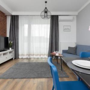 Warsaw Ursynów Apartment with Balcony by Noclegi Renters