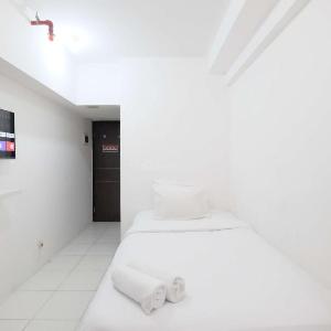 Simply Look Studio at Mont Blanc Bekasi Apartment By Travelio