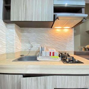 Spacious and Homey 2BR Apartment at Newton Residence By Travelio