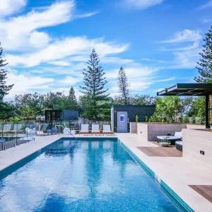 Beach front luxury with two carparks pool gym