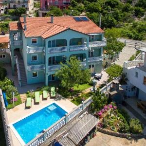 Apartments and rooms with a swimming pool Senj - 23592
