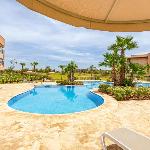 Luxury Garden-Level Apartment with Poolside Serenity 