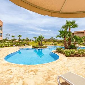 Luxury Garden-Level Apartment with Poolside Serenity