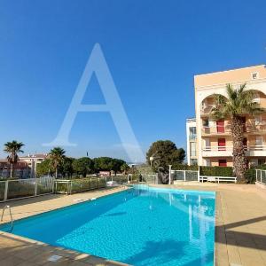 T2 avec loggia vue piscine ascenseur et place de parking