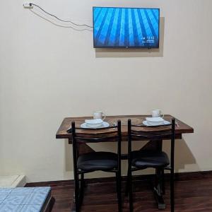 Suite Práctica de Dos Ambientes Cocina y Sofá Cama