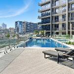 Stylish 1BR with PS5 Sauna and Kids' Play Area