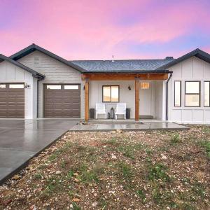 Stunner with Lake Mountain Views and Private Hot Tub