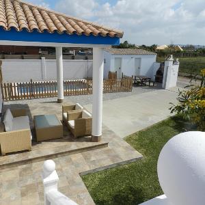 Chalet en la playa con piscina Privada en el Palmar terraza y chimenea