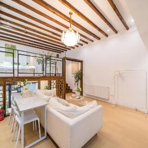 ChaoYang - Bright Open-Plan Loft with Rustic Wooden Beams