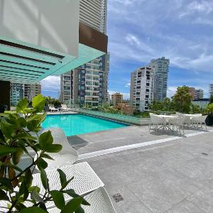 Modern 2 Bedroom Condo with Pool gym Wi-Fi.