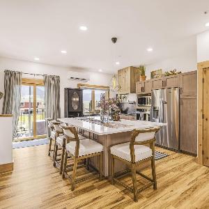 Modern Mountain condo with river views EV charger SUP