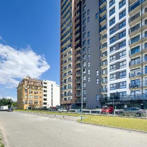Spacious Family Apartment with a Balcony and Parking by Noclegi Renters