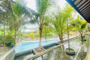 Rumah Kayu Pinggir Kali, Trawas