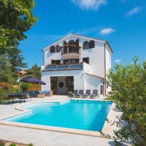 Villa Andrija Family Dream with heated pool at the sea with beautiful garden outside cinema and kids playground
