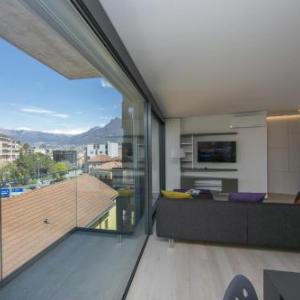 Urban Apartment Paradiso with Balcony and Parking - Happy Rentals